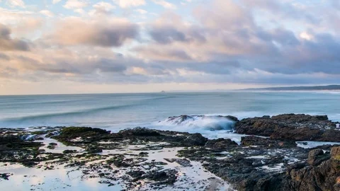 Sunset colors with fast clouds over ocean coastline Time lapse Stock Footage 103022214