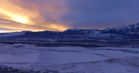 Sunset Colors Magic Hour Mountain light Snow Covered Peaks Grand Tetons Wyoming Stock-Footage 87199316