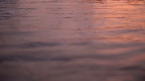 Sunset Colors Reflecting in Ocean Waves Stock Footage 120330047