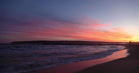 Sunset colourful sea waves at beach shore Video stock 146059976