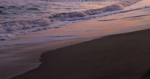 Sunset colourful sea waves at beach shore Stock Footage 146060844