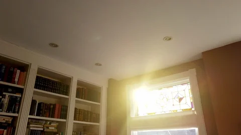 Sunset coming through beautiful reading room Stock Footage 102763310