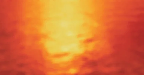 At Sunset  - Completely defocused shot of a slightly wavy water surface Vídeo Stock 78593988