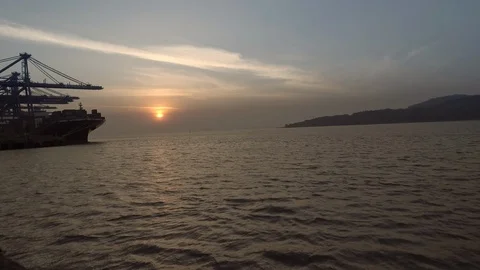 Sunset with Container Ship And River Flowing - Jawaharlal Nehru Port Navi Mumbai Stock Footage 93827333