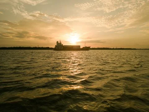 Sunset with the container ship Stock Photos