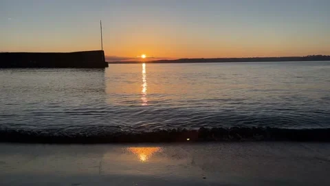Sunset in Cornwall over the sea, Par Polkerris Stock Footage 224772078
