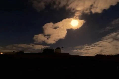 Sunset in the countryside with a windmill Stock Photos