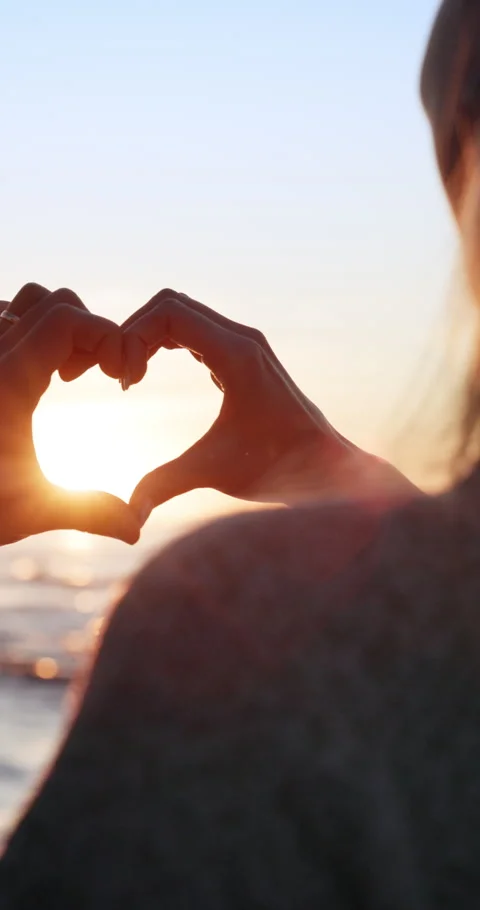 Sunset, couple and heart hands by beach with vacation, relationship commitment Stock Footage 336841092