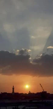 Sunset with a crane in the background Stock Photos