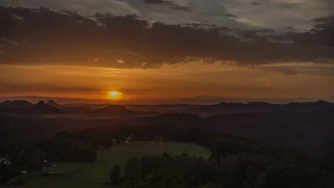 Sunset Czech Switzerland view mesa hills, fog and sheep on meadow, 4k Timelapse Stock Footage 131389846