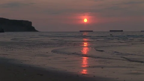 Sunset on D-Day landing beach code named Gold Beach in WWII in Normandy, FRANCE Stock Footage 101981647