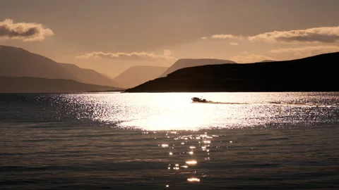 Sunset On Dalvik As A Tourist Boat Sails Out To Spot Whales Stock Footage 166641105