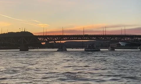 Sunset from the Danube river in front of a bridge Stock Footage 280932935