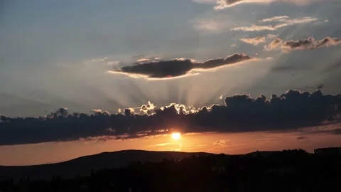 Sunset with dark clouds timelapse Stock Footage 138668621