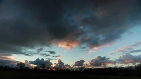 Sunset dark clouds timelapse moving fast Stock Footage 199252490