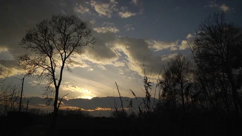Sunset with dark tone and big clouds on sky background Stock Footage 99118096