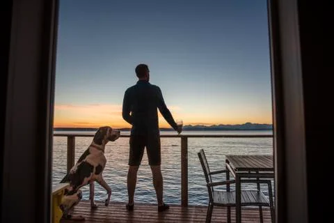 Sunset deck with pup Stock Photos