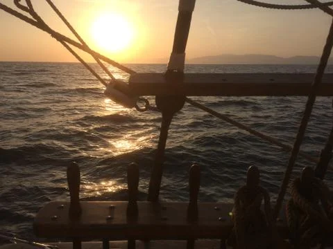 Sunset from deck of tall ship Stock Photos