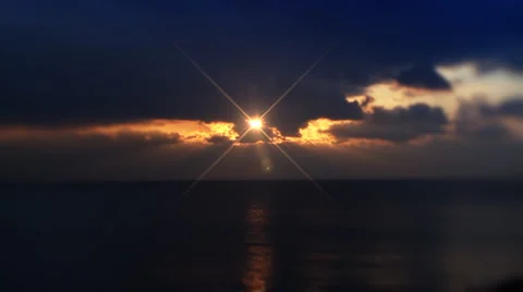 Sunset on deep blue cloudy sky, sea. Stock Footage