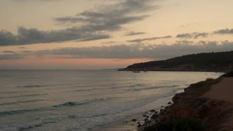 Sunset on a desert beach in Menorca in Spain Stock Footage 164681607