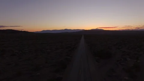 Sunset in the desert of an empty road Stock Footage 106474276