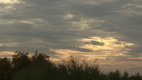 Sunset in desert over golf course with clouds Stock Footage 82913000