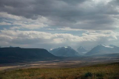 Sunset in the desert, the sun's rays Shine through the clouds. Ukok Plateau O Stock Photos
