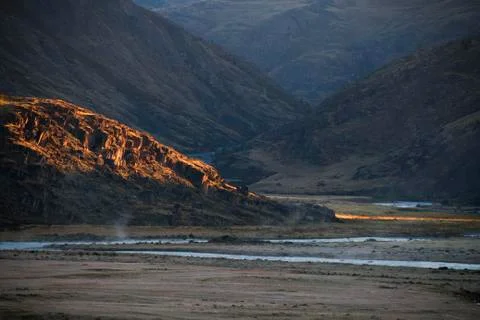 Sunset in the desert, the sun's rays Shine through the clouds. Ukok Plateau O Stock Photos