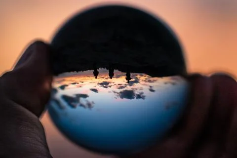 Sunset with a difference three people in Globe Stock Photos