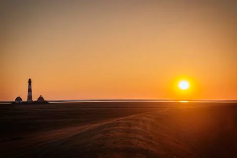 Sunset on dike of Westerhever Stock Photos