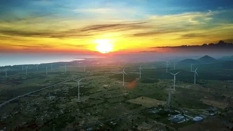 Sunset Disk Lights Wind Turbines on Field Upper View Stock Footage 85225553