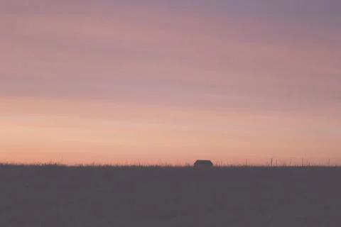 Sunset with distant home Stock Photos
