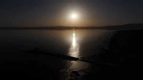 Sunset Dock PanningBackwards at the Salton Sea Bombay Beach California  Stock Footage 336815975