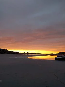 Sunset by the docks in the city in the winter Stock Photos