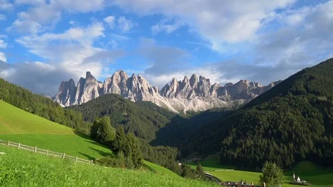 Sunset in Dolomites Alps. Mountains and green hills in Italy. Time lapse footage Stock Footage 101580442