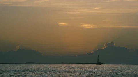 Sunset in dramatic orange sky over sea Stock Footage 97602830