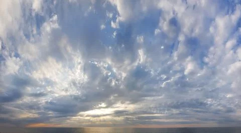 Sunset. Dramatic sky and clouds above sea beach. Atmosphere cloudscape skylin Stock Photos