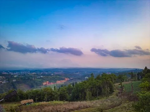 Sunset dramatic sky with mountains and forests from flat angle at dusk Stock-Fotos