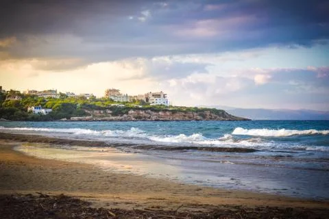 Sunset with dramatic sky over the beach at Rafina, Greece Stock Photos
