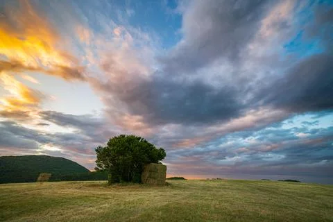 Sunset dramatic sky over Fabriano city, Marche, Italy. Sunbeams among clouds  Stock Photos