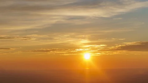 Sunset with dramatic yellow &amp; orange clouds - Time lapse 動画素材 118580978