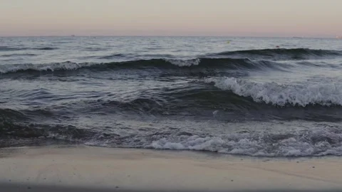 Sunset Dream: Ocean Waves in the Evening Glow Stock Footage 293684541