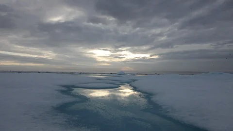 Sunset on the drifting ice floe  on the Arctic Ocean - Time lapse Video stock 104959934