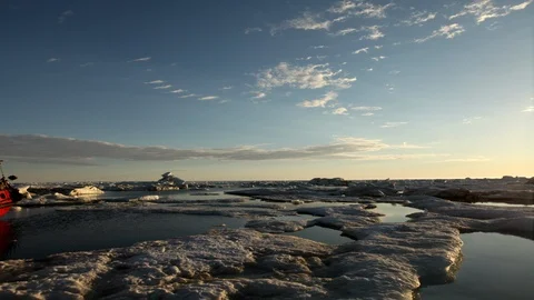 Sunset on the drifting ice floe on the Arctic Ocean - Time lapse Video stock 104961417