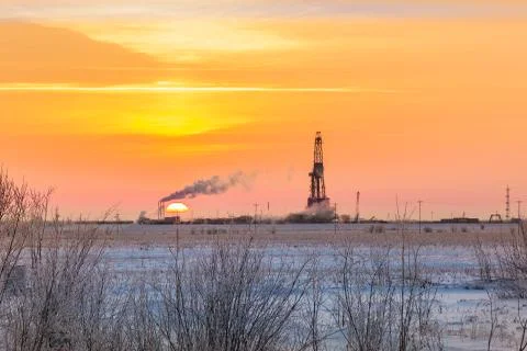 Sunset on the drilling 스톡 사진