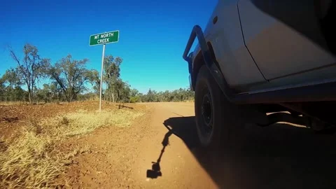 Sunset driving  4WD in australian Outback gravel road Stock Footage 325081947