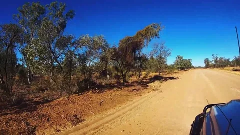 Sunset driving  4WD in australian Outback gravel road Stock Footage 325081956