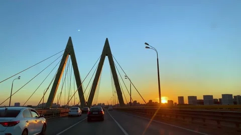 Sunset driving through Millenium brigde in Kazan Stock Footage 197348390