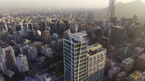 Sunset drone drift over Apoquindo skyline toward Costanera Center Santiago Chile Vídeos de archivo 334682873
