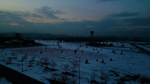 At sunset, a drone flying with crows over the road 動画素材 294800222